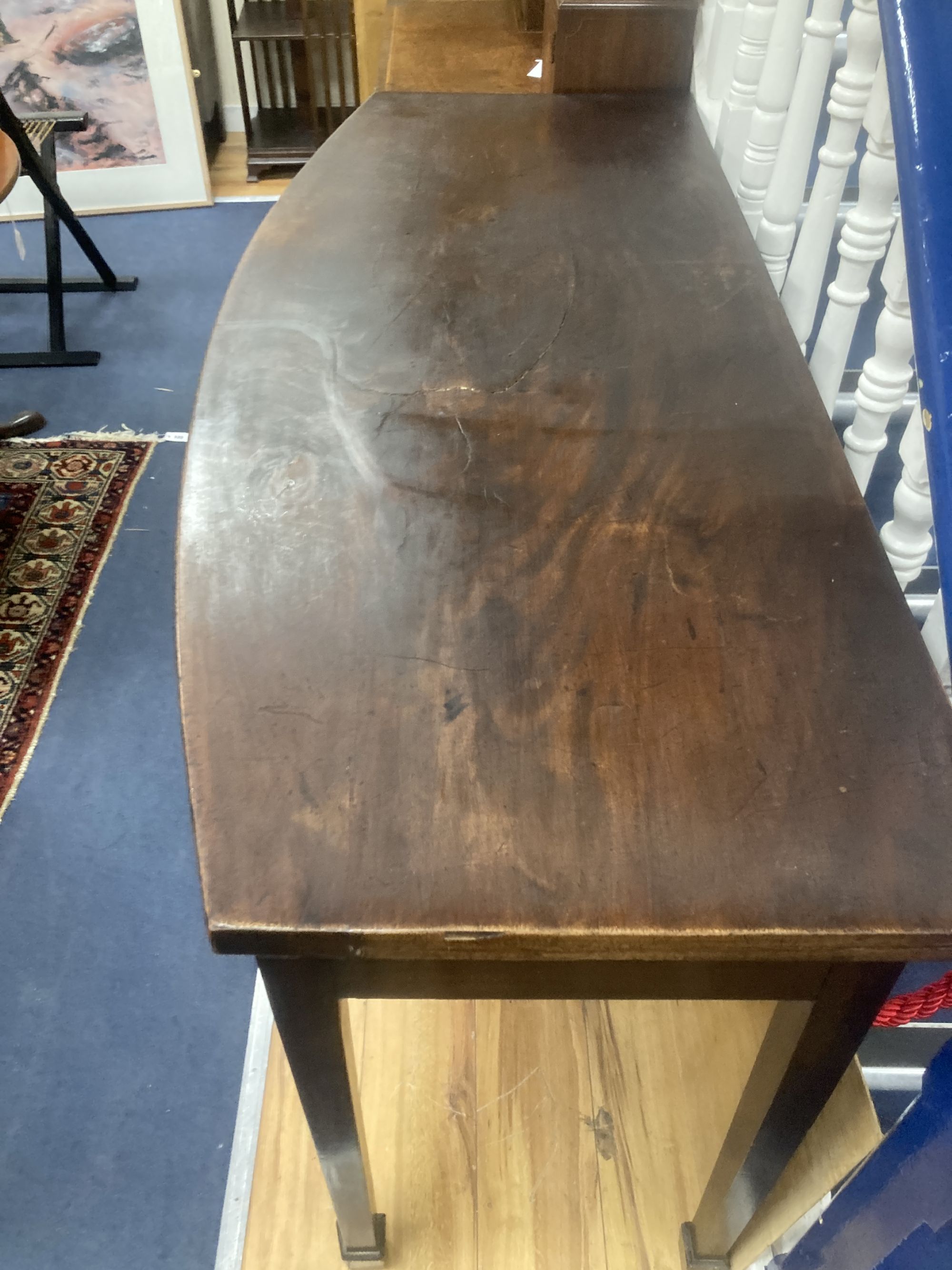 A George III mahogany bowfront serving table, width 142cm, depth 60cm, height 92cm